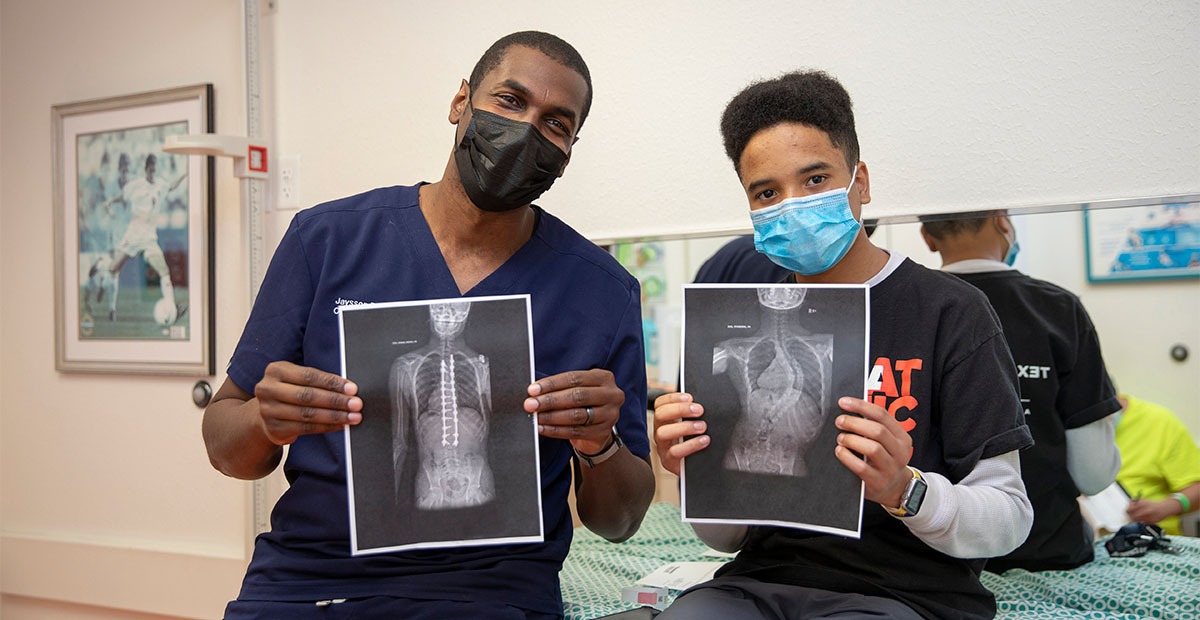 Dr. Brooks with patient, Xavier