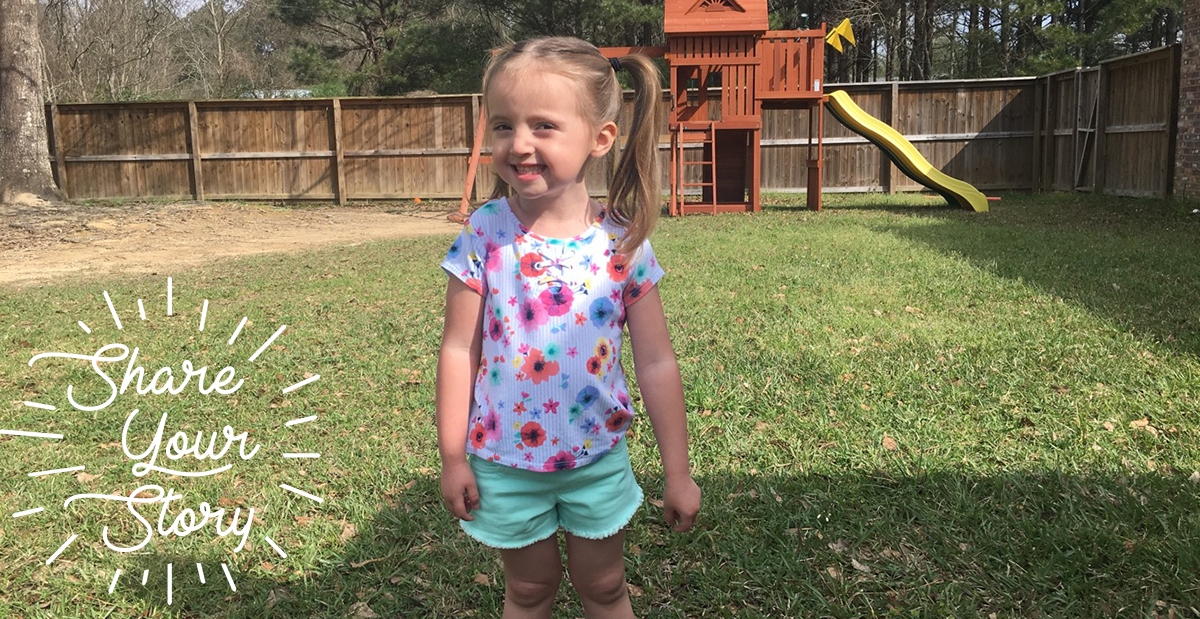 Andi in yard with swingset