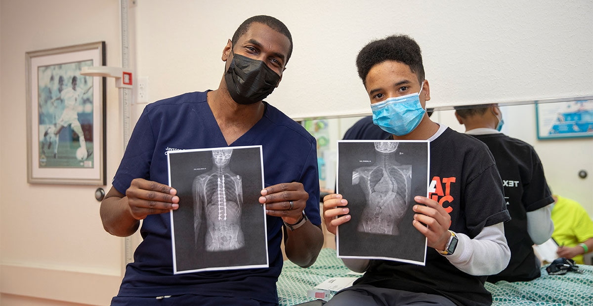 Dr. Brooks with patient, Xavier