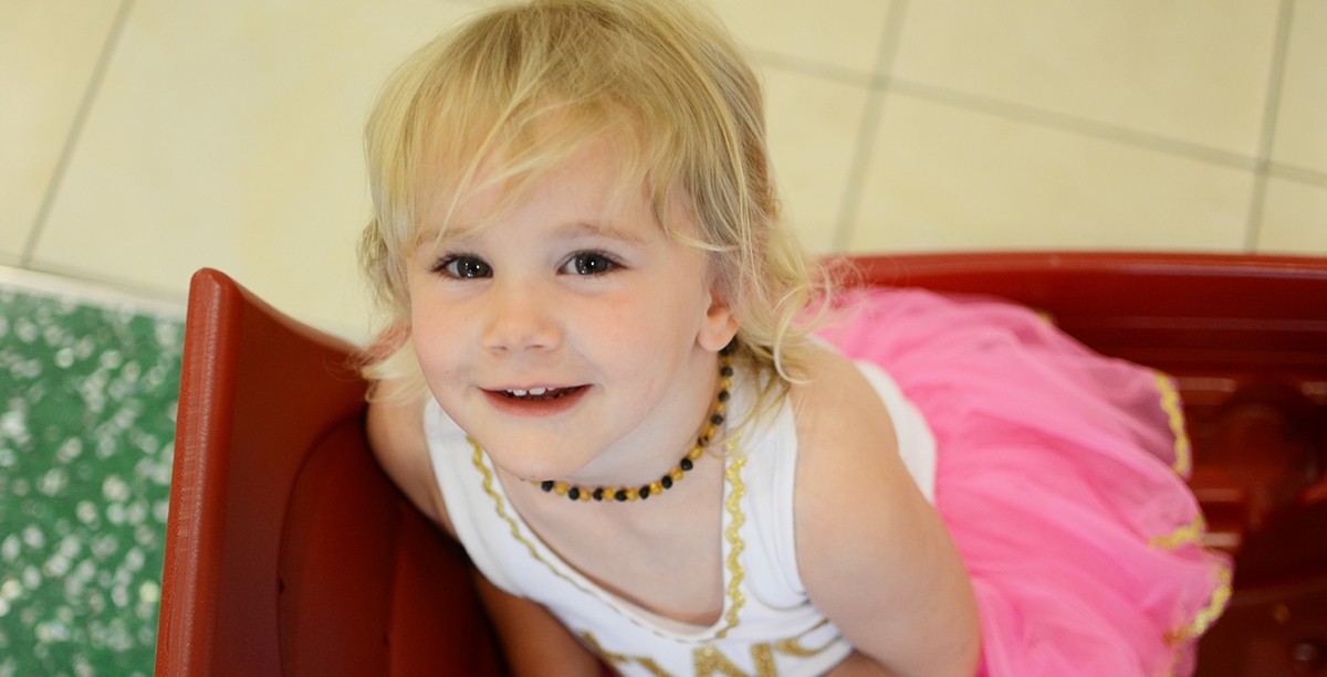Clubfoot Patient sitting in a wagon.