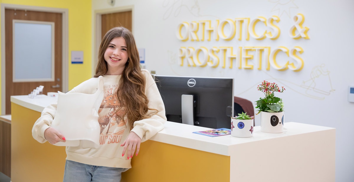 scoli-brace-blog Patient holding her scoliosis brace.