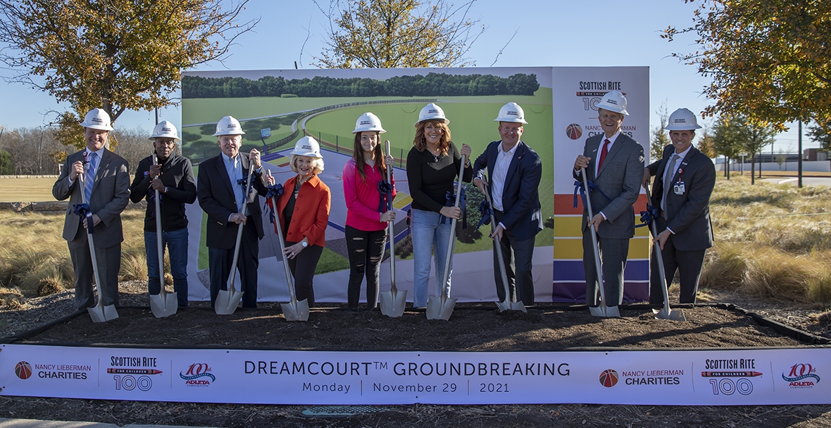 Frisco_Nancy-Lieberman-DreamCourt-Groundbreaking_11-29-2021_048 A group of people holding shovels in front of a sign that says dreamcourt groundbreaking | NANCY LIEBERMAN CHARITIES SCOTTISH RITE FOR COFLOP 100 10% ADLETA Cahashi SCOTTISH RITE 10 NANC CH MAN S DREAMCOURTTM GROUNDBREAKING Monday November 29 NANCY LIEBERMAN CHARITIES 2021 SCOTTISH RITE FOR CHILORE 100 10 ADLETA