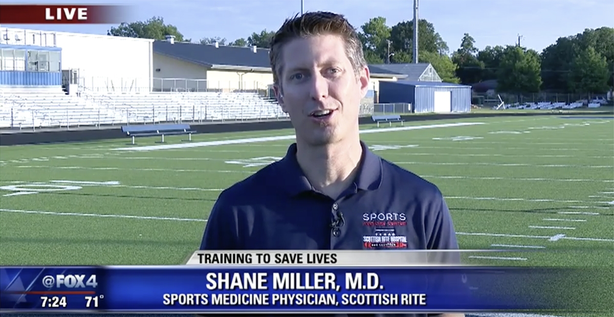 Shane-Miller-live-spot-0724 Dr. Miller on football field