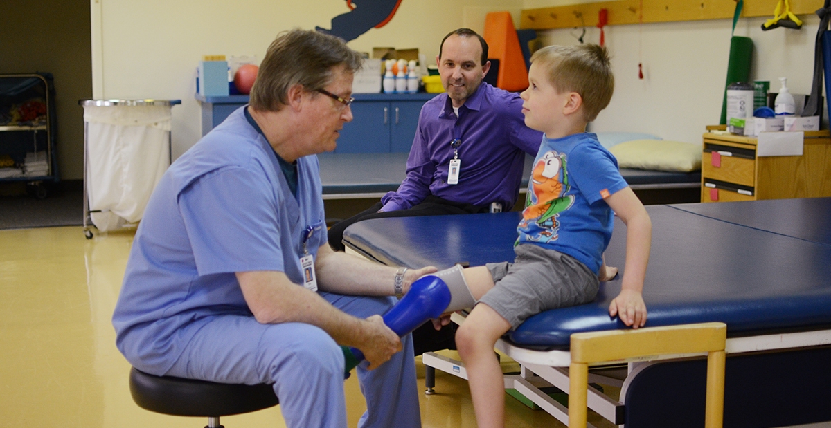 Don Cummings, Charter Rushing, Silas Pokall prosthetics Physical Therapy don in physical therapy room with patient