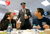 Capt. Jim Dees, Director of Flight with American Airlines, center, talks with Diana Lopez, 16, left, and Alfonso Apodaca, 15, teenage amputee patients from Scottish Rite Hospital, during a ceremony at Dallas-Fort Worth International Airport in DFW Airport, Monday, Feb. 12, 2018.(Jae S. Lee/Staff Photographer) Capt. Jim Dees, Director of Flight with American Airlines, center, talks with Diana Lopez, 16, left, and Alfonso Apodaca, 15, teenage amputee patients from Scottish Rite Hospital, during a ceremony at Dallas-Fort Worth International Airport in DFW Airport, Monday, Feb. 12, 2018.(Jae S. Lee/Staff Photographer)